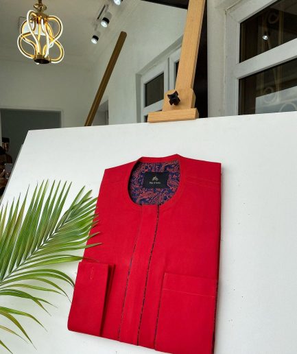 A Tomato Red Kaftan, With mixed blue and red paisley detailing and sokoto