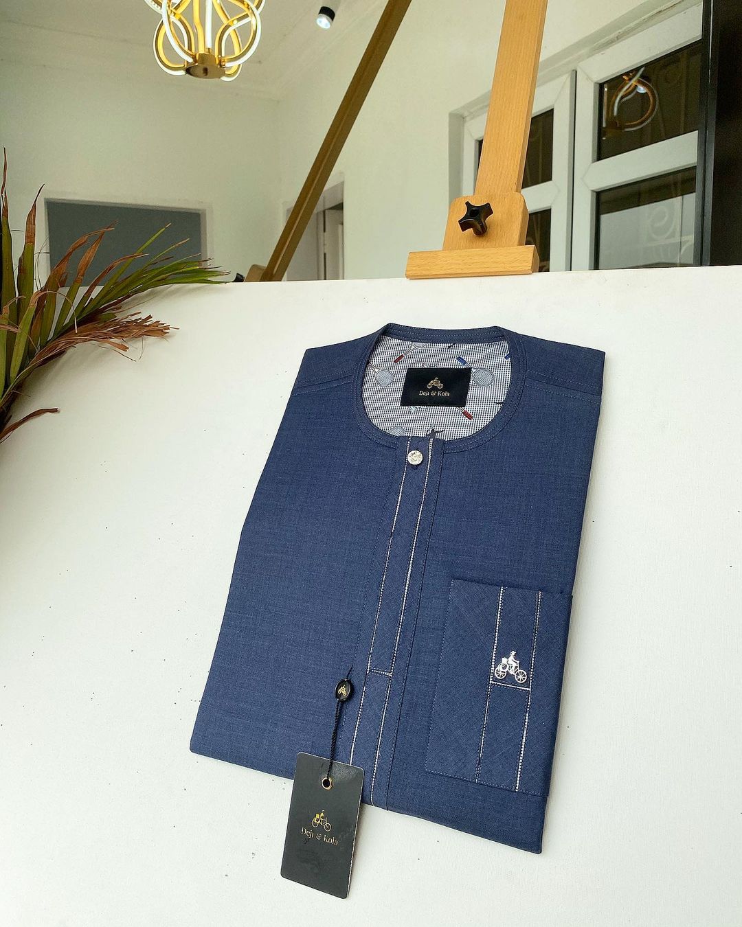 Shop Navy blue kaftan with an interlocking pocket design - Deji & Kola