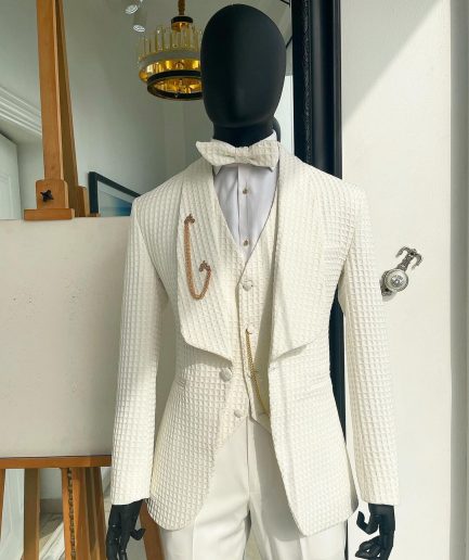 An Ivory White “French” safari suit and matching pant trousers